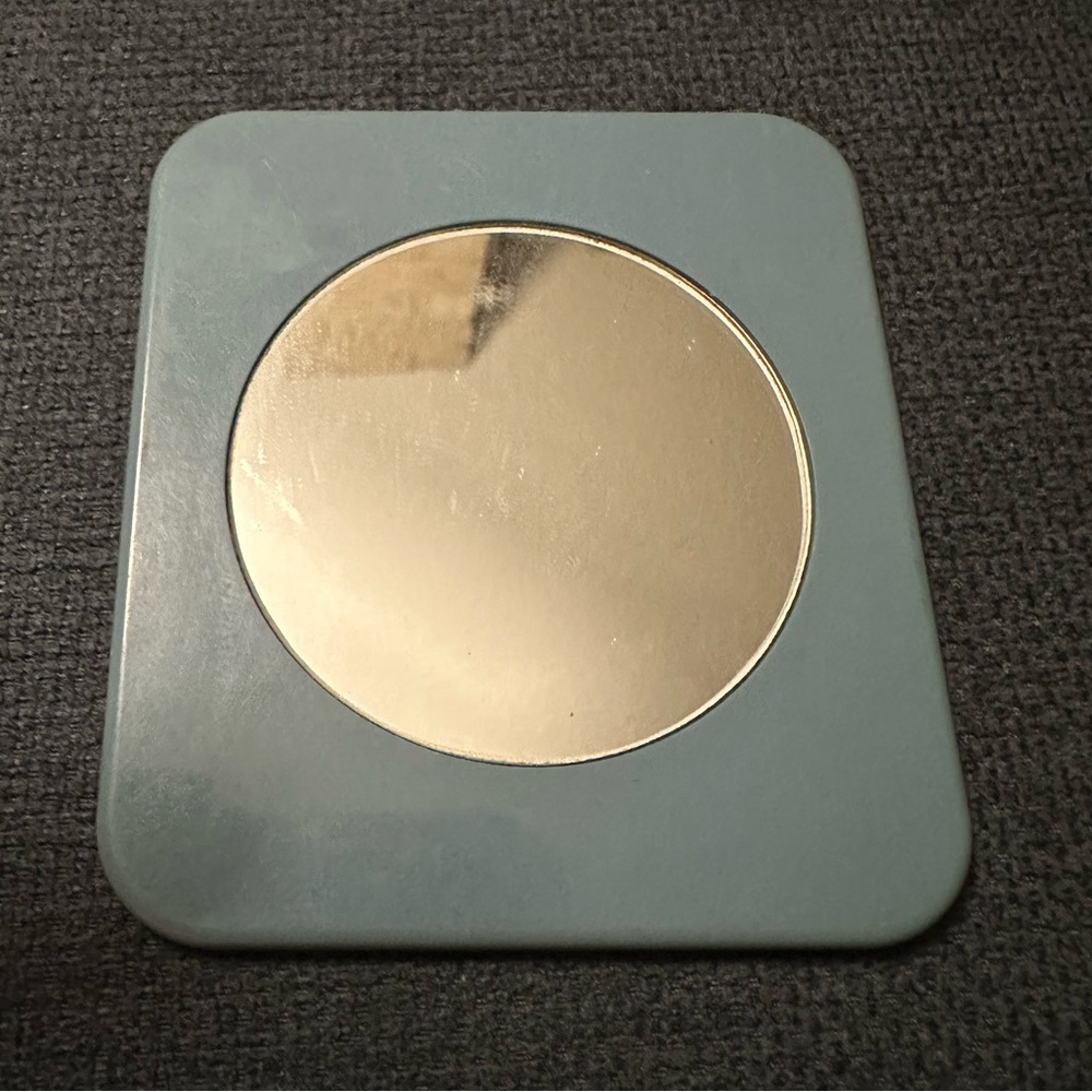 Small Estée Lauder hand mirror